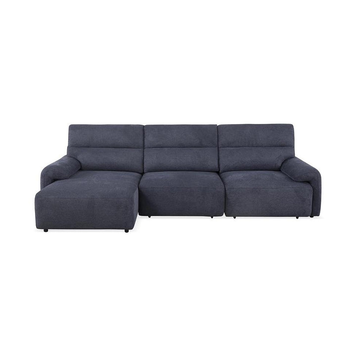 Dark blue three-seater sofa with a left-side chaise lounge, plush fabric upholstery, and rounded armrests.