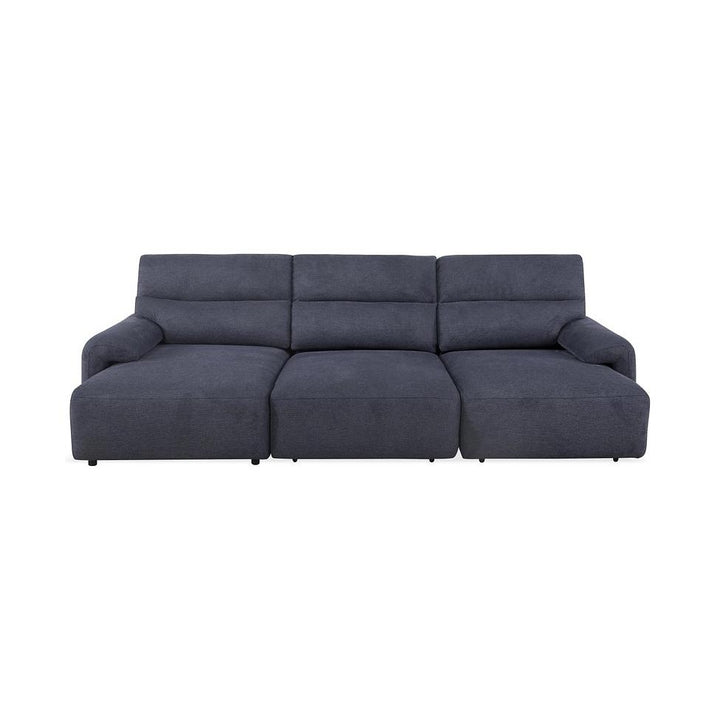 Dark grey modern sofa with plush cushions and a chaise extension on the right.