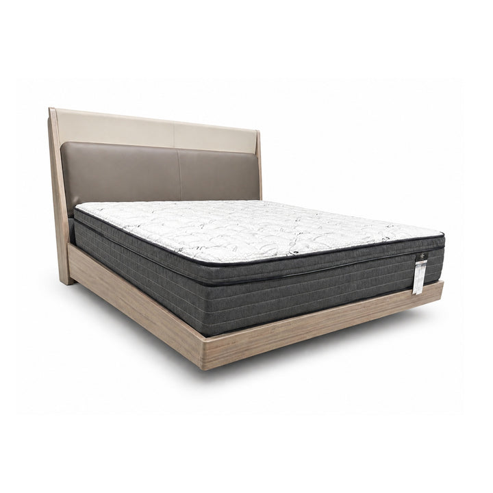 Two-tone leather headboard bed frame with beige and taupe panels, light wood base, and white mattress.