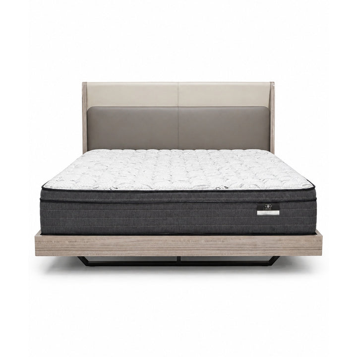 Front view of a bed with a two-tone beige and taupe upholstered headboard, white quilted mattress, and light wood platform base.