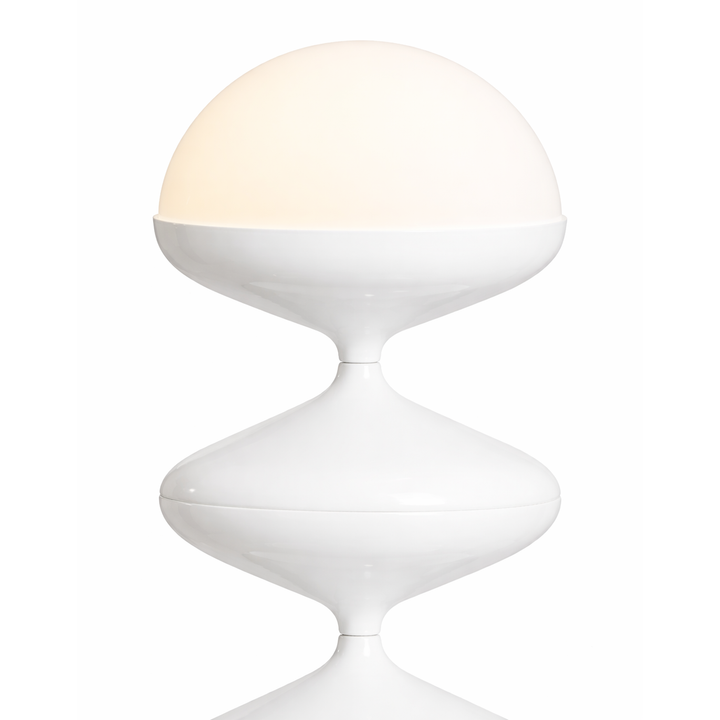 Modern white table lamp with a spherical shade on a white background