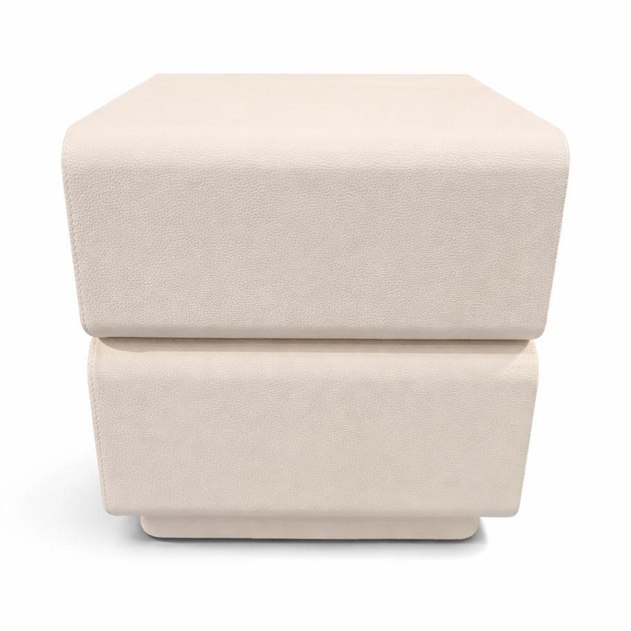 Textured cream nightstand featuring two stacked tiers and rounded corners