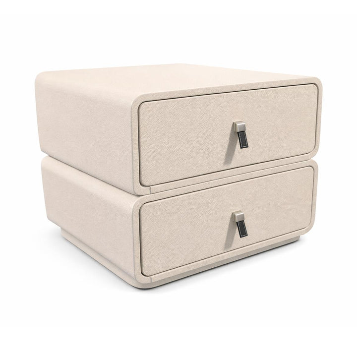 Light beige upholstered nightstand with two stacked drawers, rounded corners, and silver metal handles.