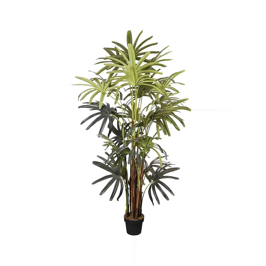 An artificial plant with green fronds and brown stalks stands in a black pot on a white background.