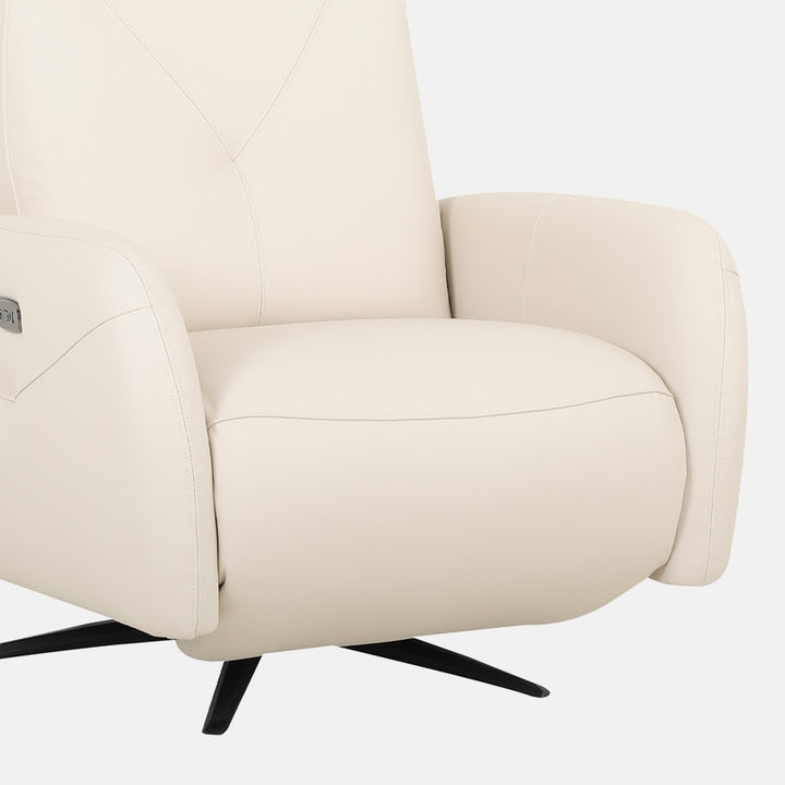 Close-up of a bisque-colored leather recliner armchair on a white background, showcasing the swivel base, armrest, and stitching detail.