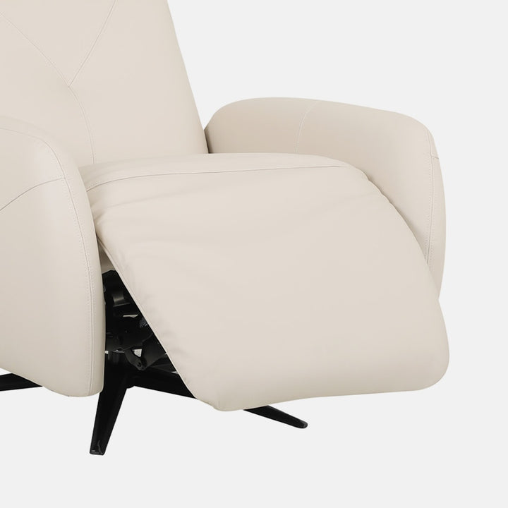 Close-up of a bisque leather sofa chair with extended footrest on a white background.
