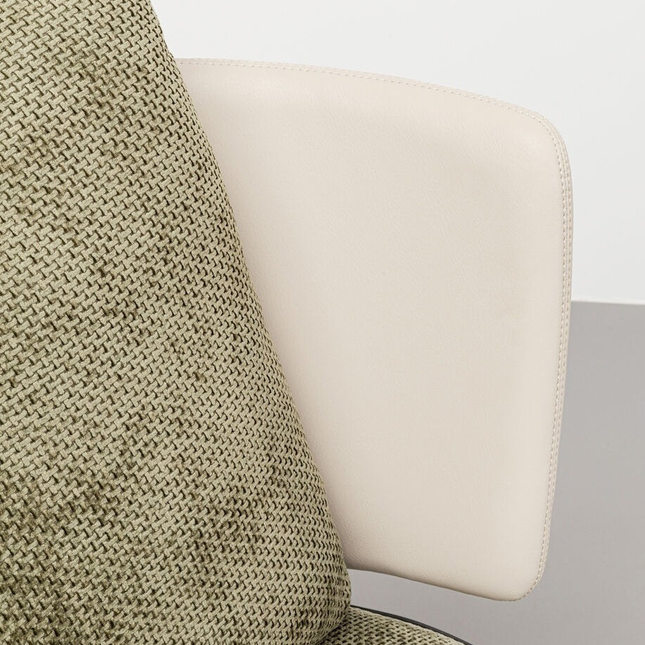 Close-up detail of an accent chair, showing the woven polyester fabric of the cushion and the leather or faux leather backrest, emphasizing the texture and materials.