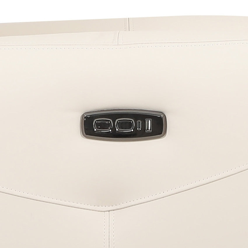 Close-up shot of a bisque leather sofa chair, focusing on the material texture and design details including the metal control panel.