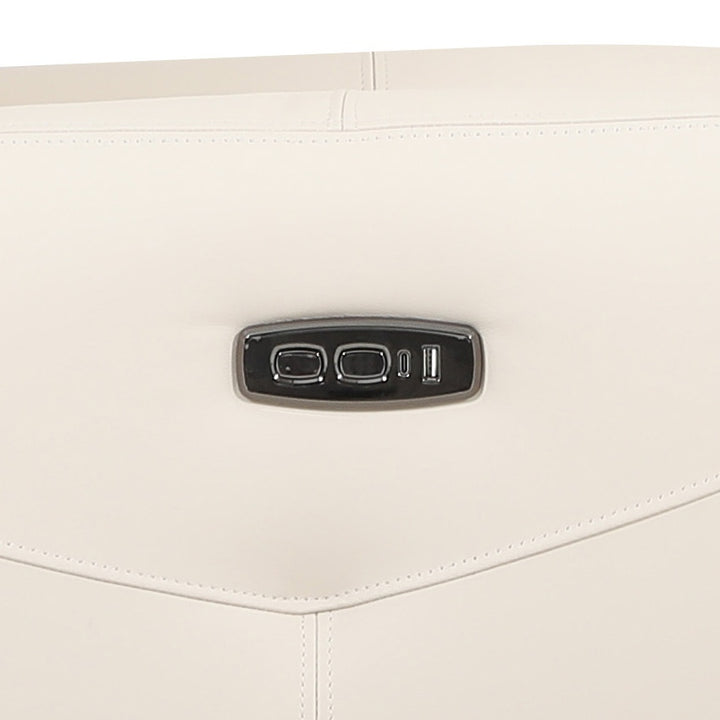 Close-up shot of a bisque leather sofa chair, focusing on the material texture and design details including the metal control panel.
