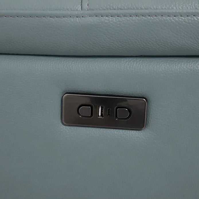 Close-up detail of a leather sofa with a control panel, showcasing the material and the integrated features.