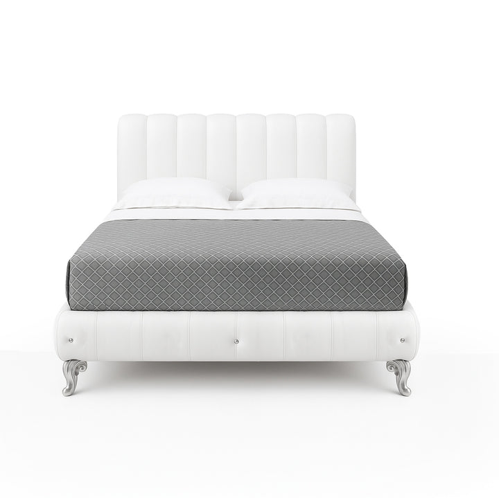 A white leather bed with a tufted headboard and footboard, silver legs, and a gray patterned blanket, set against a white background.