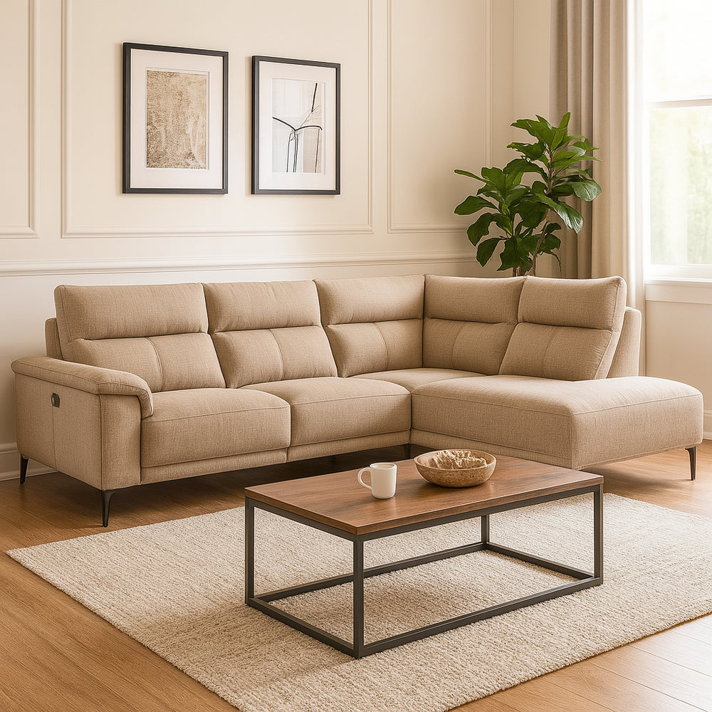 Beige sectional sofa in a living room with a wooden coffee table and decorative items.