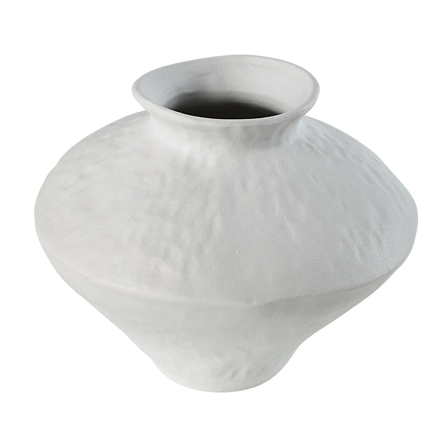 Close-up of a white ceramic vase with a textured surface, isolated on a white background.