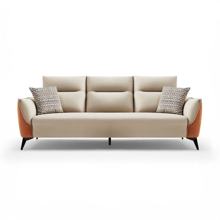AVERY Extra Wide Sofa in beige leather with contrasting orange curved arms, black tapered legs, and patterned throw pillows.