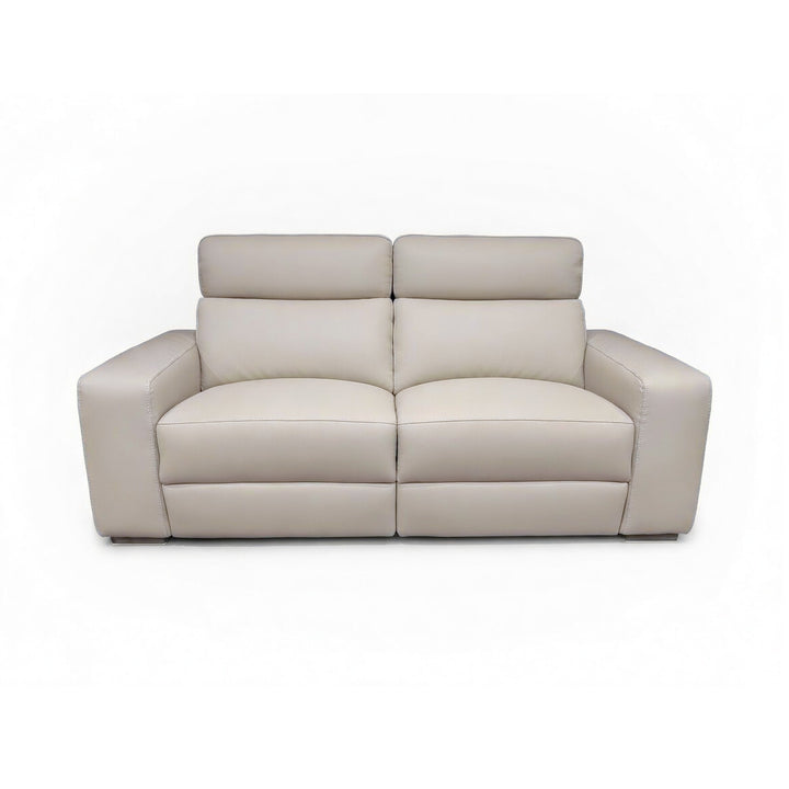Beige leather two-seater sofa with separate headrests and plush cushions.