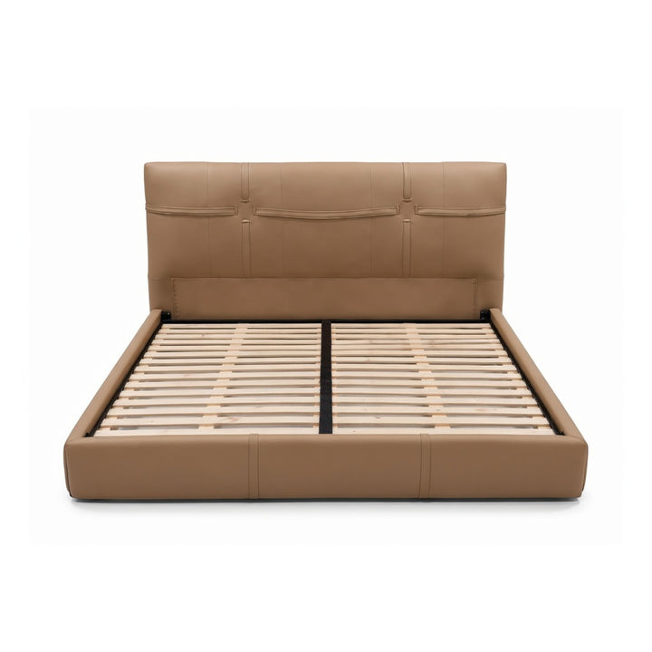 Tan upholstered platform bed with a tall, tufted headboard and visible wooden support slats.
