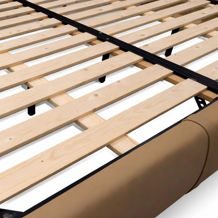 Light wood slats secured by black metal brackets on a frame with a tan fabric side panel.