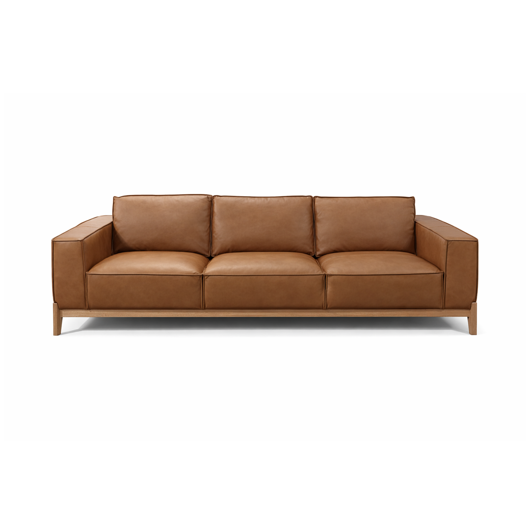 Cognac leather three-seater sofa with light wood frame and tapered legs