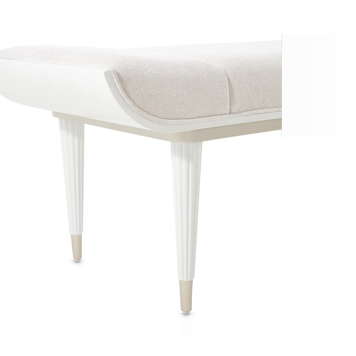 Close-up studio shot of a white and beige upholstered bench against a white background.