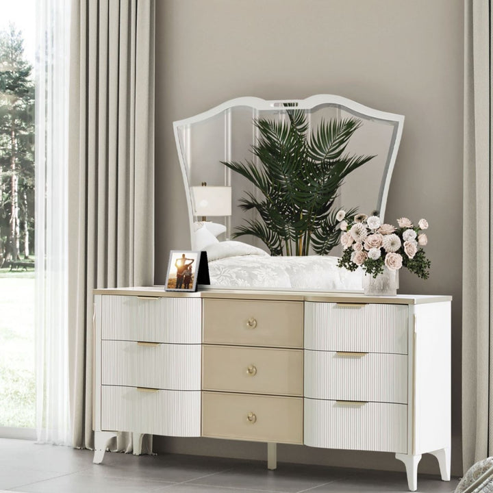 Bedroom scene featuring a dresser with a mirror and decorative elements.