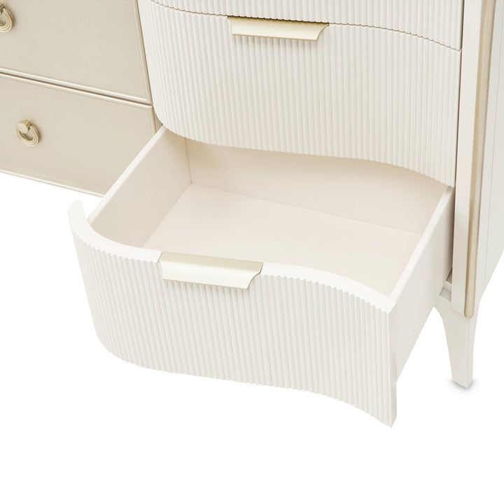 Close-up of a white chest of drawers with an open drawer, showcasing the texture and handle design, set against a white background.