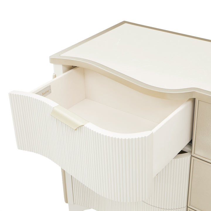 A white dresser with open drawer isolated on a white background.