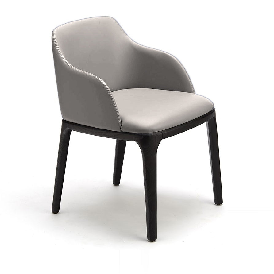 Grey upholstered dining chair with curved backrest and black tapered wooden legs