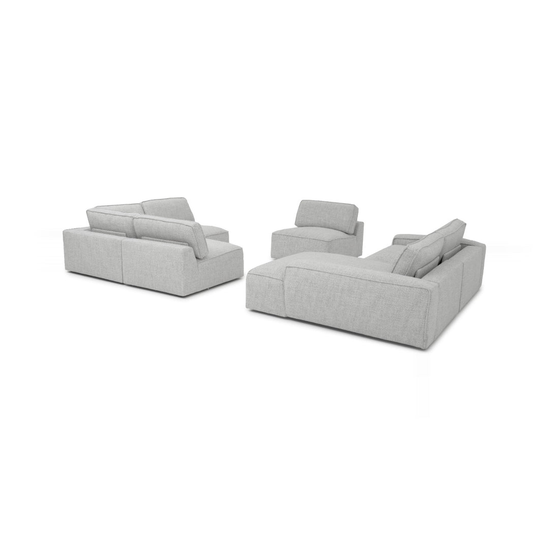 A gray sectional sofa and armchair are displayed on a white background.