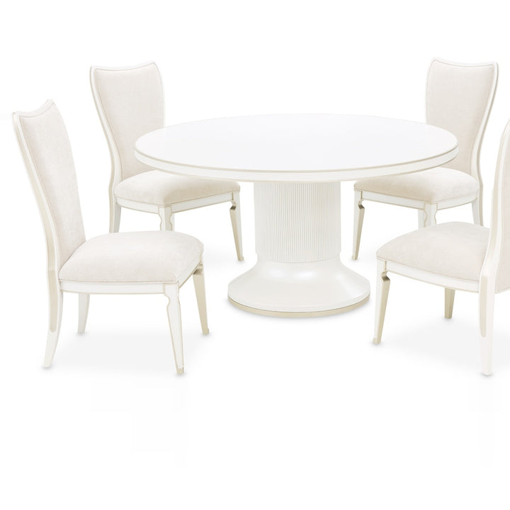 A round white dining table surrounded by four matching chairs, all on a white background, showcasing the furniture set.