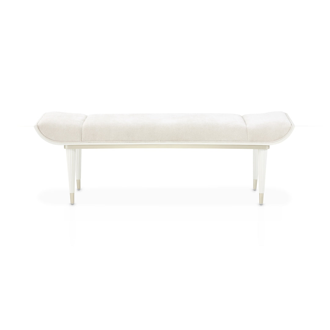 Upholstered bench with light cream fabric and light wood legs, isolated on a white background.