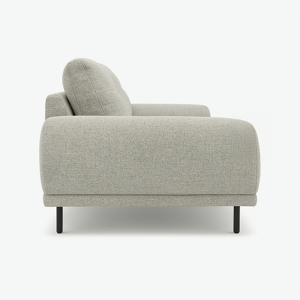 Side view of a light gray sofa with black legs on a white background.