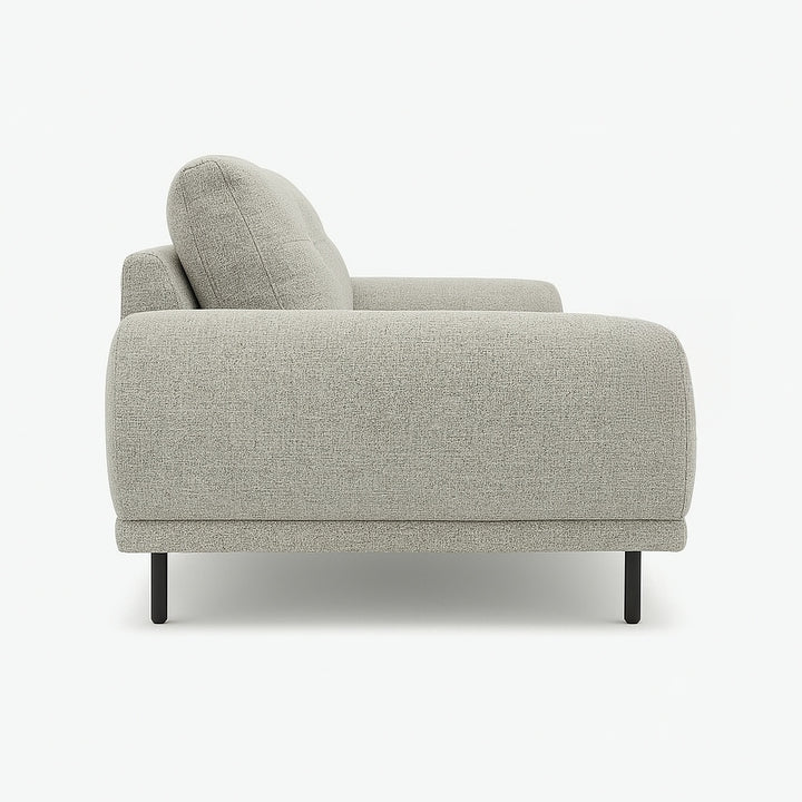 Side view of a light gray sofa with black legs on a white background.