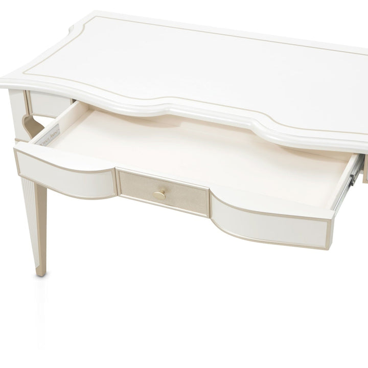 A white vanity desk with a partly open drawer isolated on a white background.