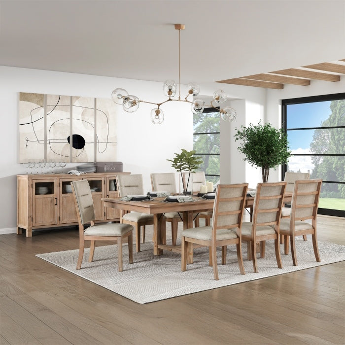 A dining room scene showcasing a wooden dining table with upholstered chairs, a matching sideboard, a modern chandelier, and a large abstract artwork.