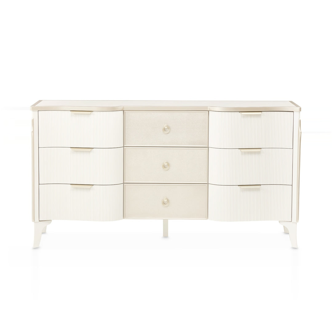 A white dresser with three drawers on each side and three drawers in the center, all on a white background.