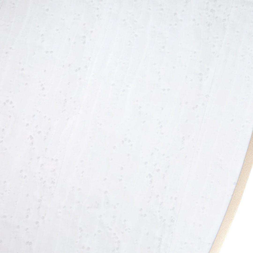 Close-up shot of a white material with subtle patterns and a beige edge visible in the bottom right corner.