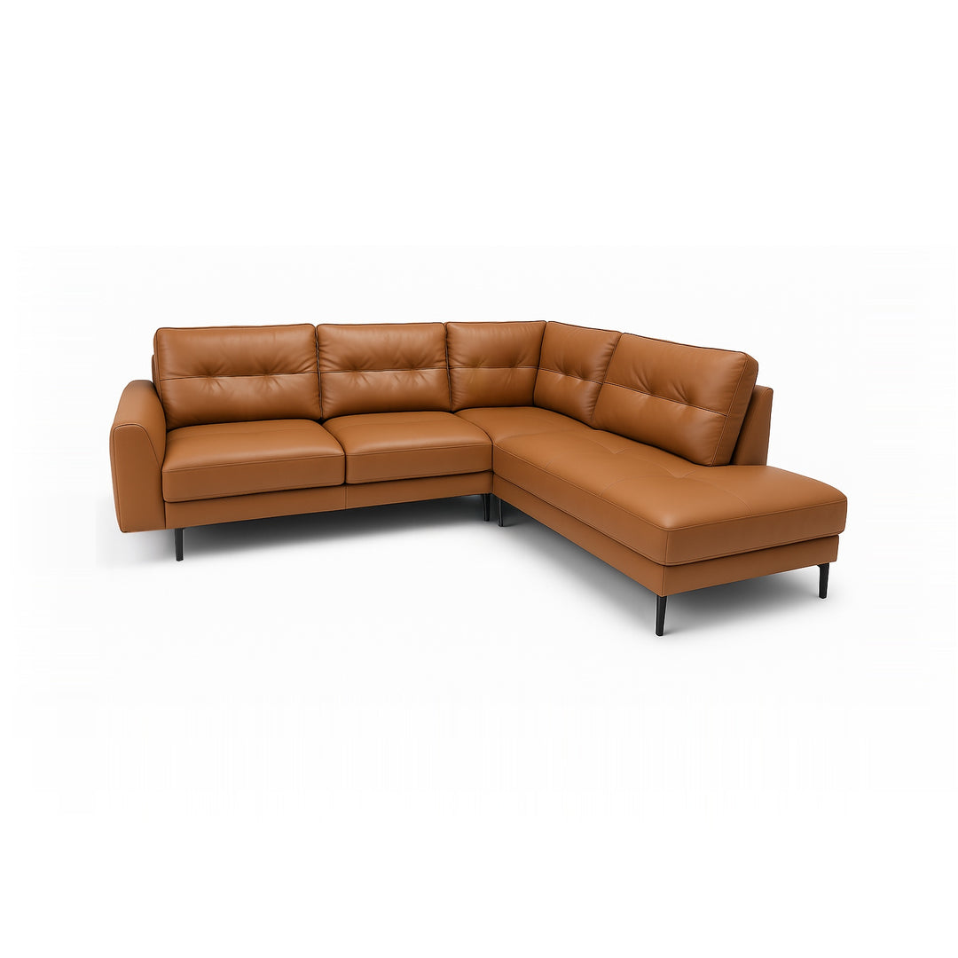 A caramel-colored leather sectional sofa with a chaise lounge on a white background.