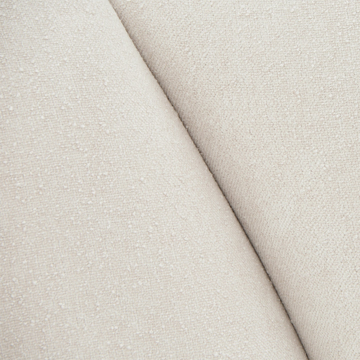 Close-up of a textured off-white fabric, likely upholstery material.