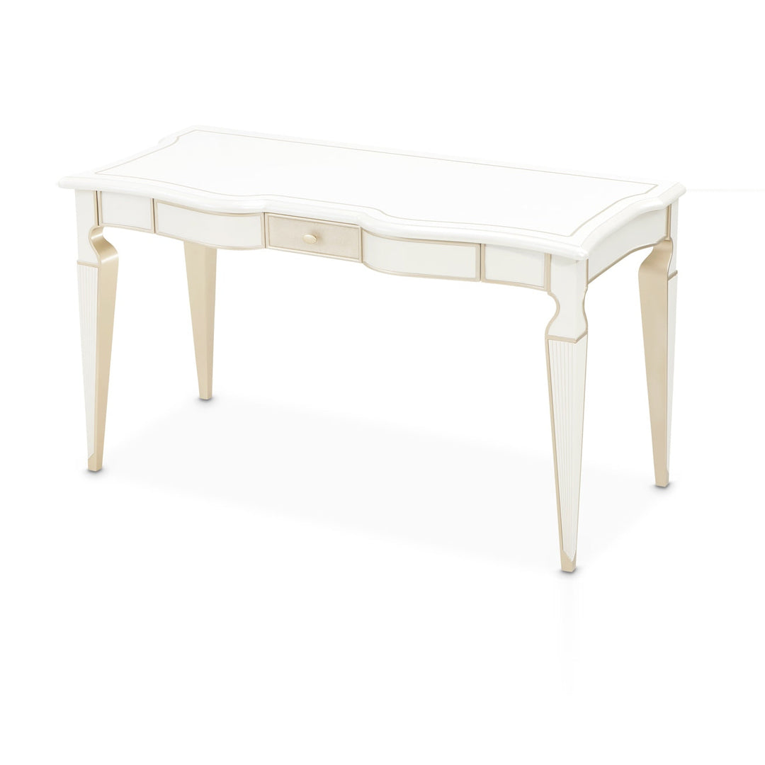 A cream-colored desk with gold accents is displayed on a white background.