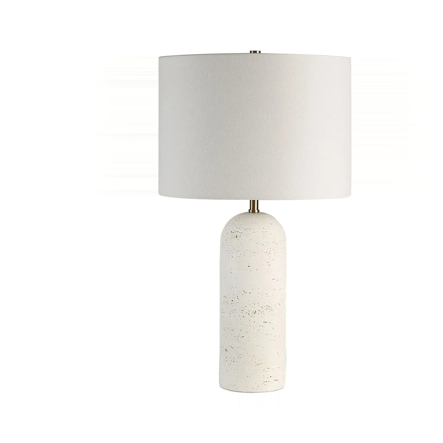 A marble-based lamp with a white lampshade against a white background.