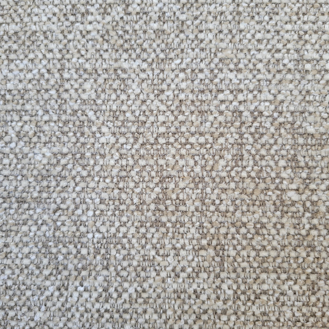 Close-up of textured beige fabric.