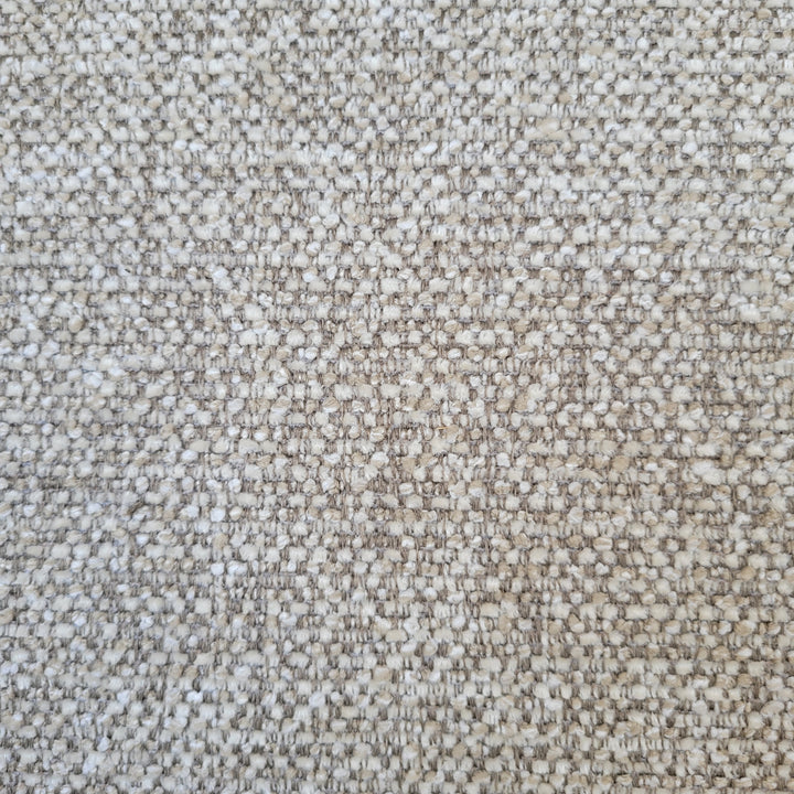 Close-up of textured beige fabric.