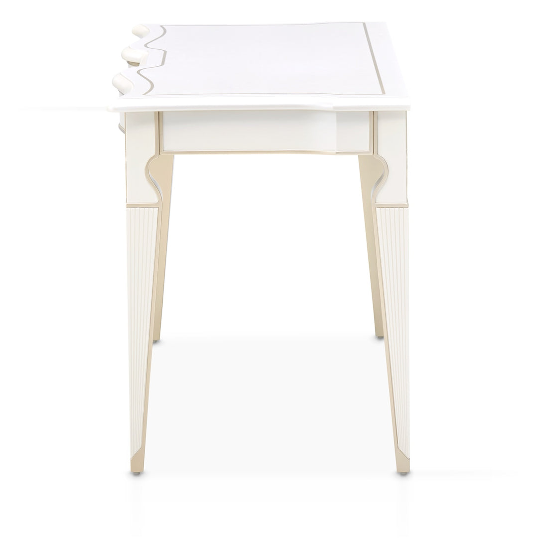 A side view of a white and beige desk against a white background, showcasing its design and construction.