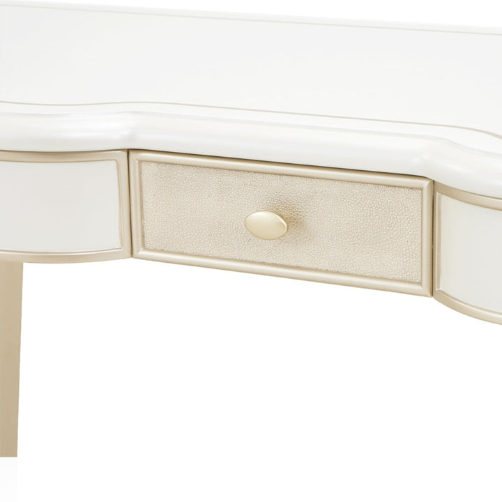 Close-up of a white and gold vanity with one drawer, isolated on a white background.