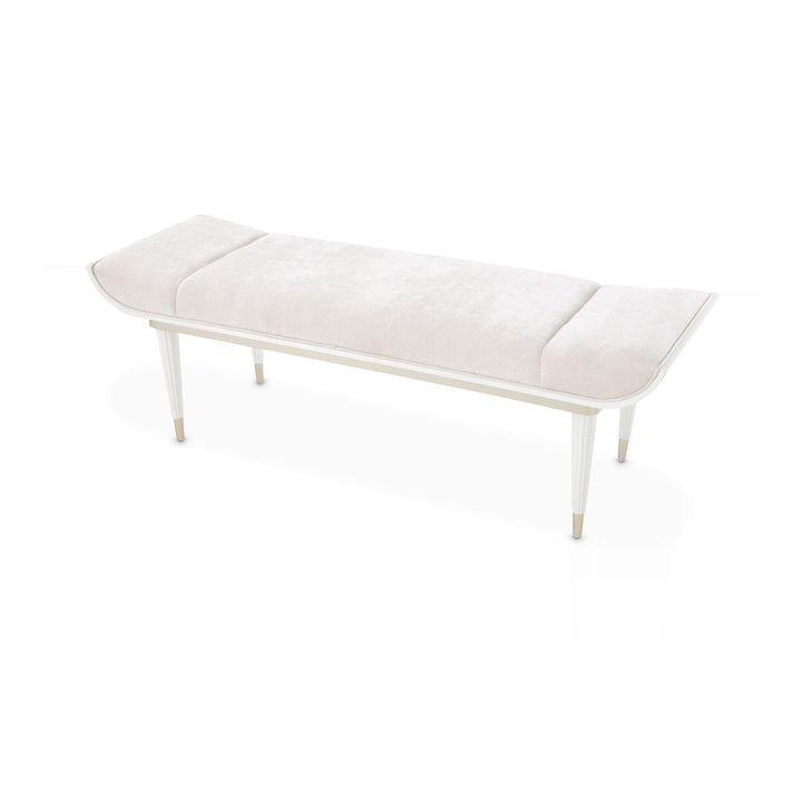 A white upholstered bench with light-colored wooden legs is displayed on a stark white background.