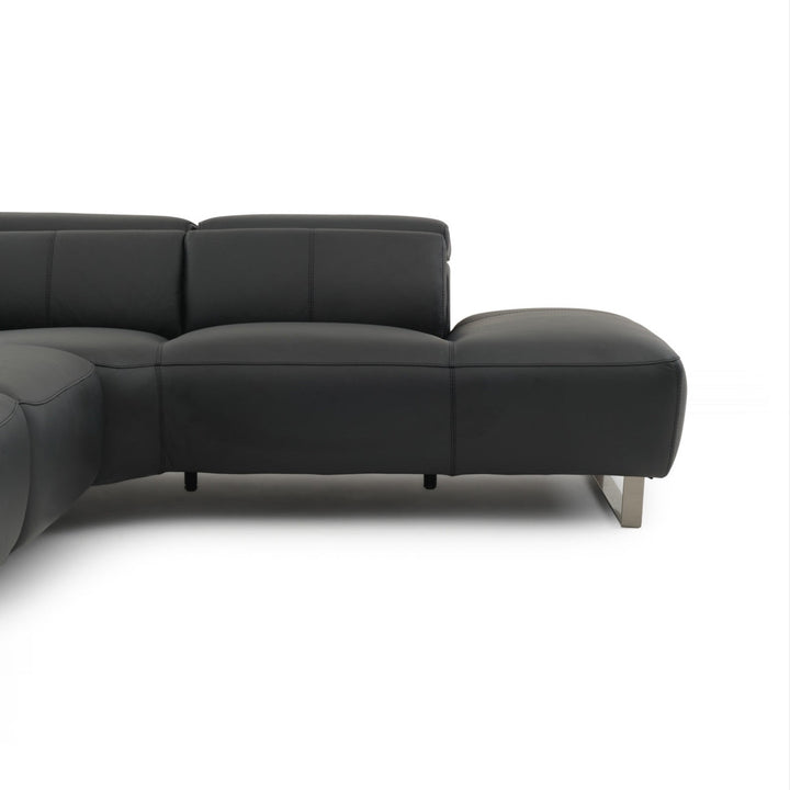 Close-up of a black leather sectional sofa with metal legs on a white background.